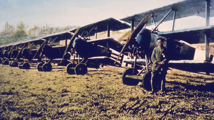 Airman Stands Near Fokker DR-1s