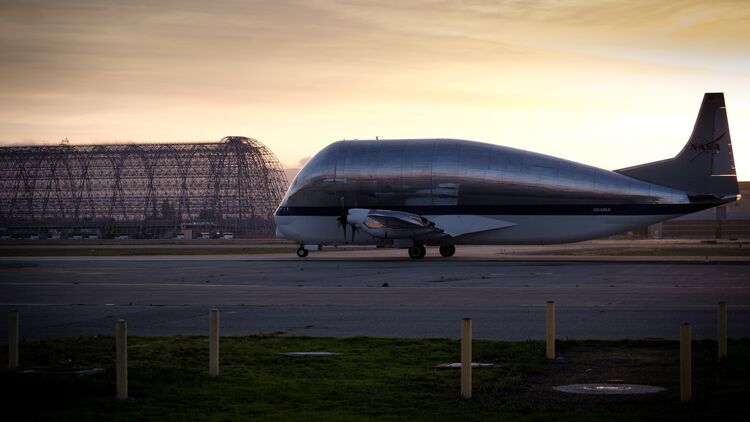 Artemis 4 Orion heat shield skin arrival on Super Guppy aircraft at Moffet Airfield.
