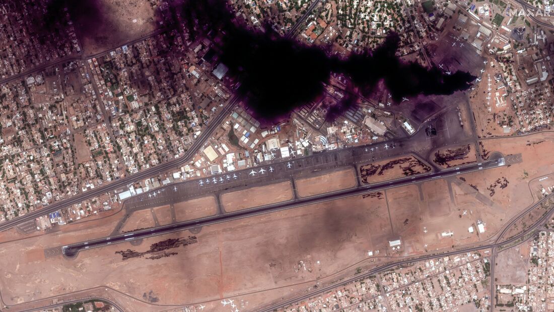 KHARTOUM, SUDAN -- APRIL 16, 2023:  Maxar overview satellite imagery of the fire smoke plume at the Khartoum international Airport, Sudan..   Please use: Satellite image (c) 2023 Maxar Technologies.