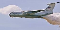 The Il-76 plane dumps water onto a tank range so that there