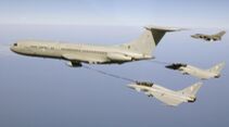 Two Typhoon fighters refuel in mid air with a VC 10 aircraft
