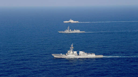 USS Gabrielle Giffords steams in formation with USS Dewey, JS Akebono